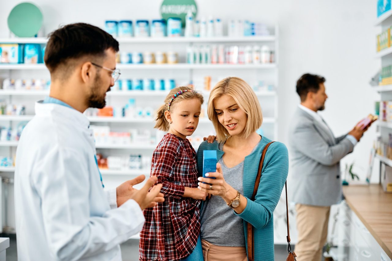 happy-mother-with-daughter-buying-in-a-pharmacy-.jpg