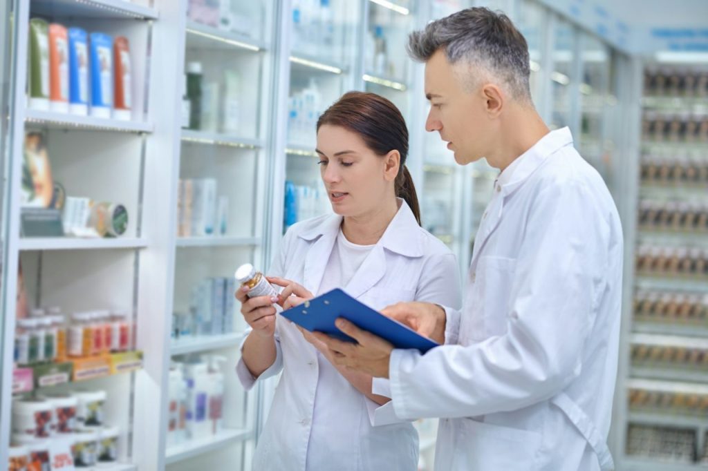 two-pharmacists-making-medicines-revision-in-a-drugstore.jpg